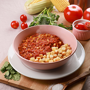 Guiso casero chileno con tomate, maíz y papas. Emporio La Rosa